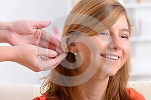 Woman wearing deaf aid