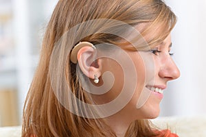 Woman wearing deaf aid