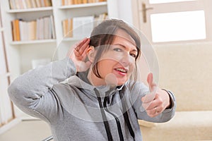 Woman wearing deaf aid