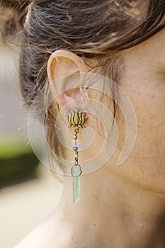 Woman wearing decorative earrings