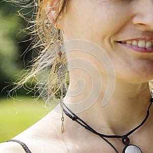 Woman wearing decorative earrings