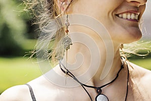 Woman wearing decorative earrings