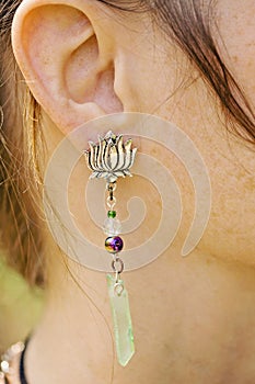 Woman wearing decorative earrings