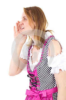 Woman wearing dirndl whispering to her friend
