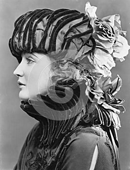 Woman wearing elaborate hat photo