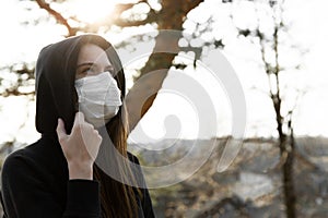 Woman wearing face mask during coronavirus outbreak. Protection against virus infection exhaust and industrial emissions