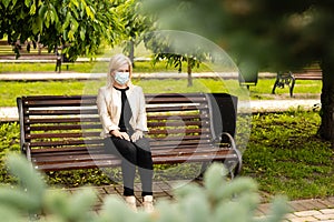woman wearing face mask in park photo