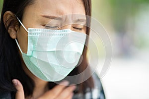 Woman wearing face mask protect filter against air pollution PM2.5 or wear N95 mask. protect pollution, anti smog and viruses,