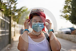 Woman wearing a face pollution mask to protect himself from the coronavirus