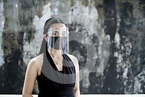 A Woman Wearing Facemasks and Faceshield