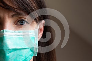 Woman wearing facial protection mask in a natural light