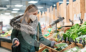 Woman wearing ffp2 face mask shopping in supermarket