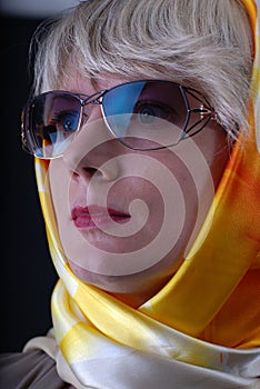 Woman wearing glasses and neckerchief