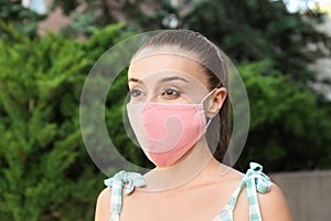 Woman wearing handmade cloth mask outdoors. Personal protective equipment during COVID-19 pandemic