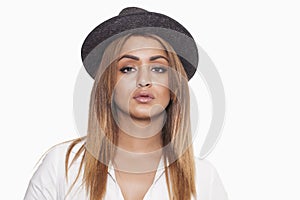 Woman wearing hat and shirt and looking