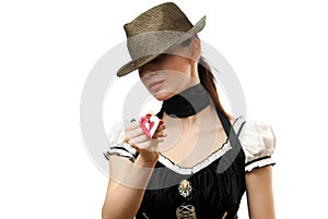 Woman wearing hat showing heart shaped pendent