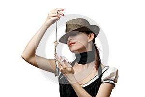 Woman wearing hat showing key shaped pendent