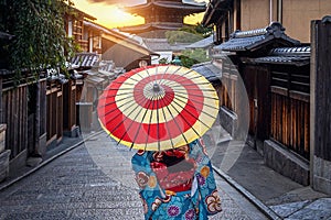 Woman wearing japanese traditional kimono with umbrella at Yasaka Pagoda and Sannen Zaka Street in Kyoto, Japan