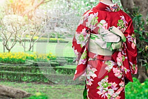 Woman wearing Kimono traditional Japan walking at public park.