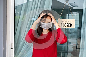 Woman wearing mask closed store with sign board front door shop, Small business come back turning