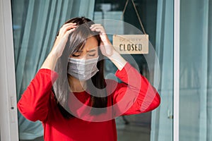 Woman wearing mask closed store with sign board front door shop, Small business come back turning