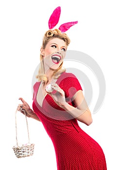 Woman wearing a mask Easter bunny and looks very sensually. model dressed in costume Easter bunny. Hunting eggs