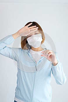 Woman wearing mask get sick from corona virus,, flu symptom as sneezing, cough, fever, body ache, breathing , pain