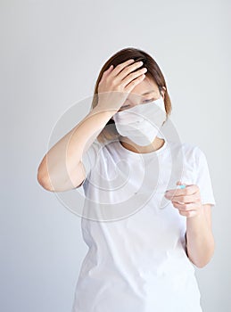 Woman wearing mask get sick from corona virus,, flu symptom as sneezing, cough, fever, body ache, breathing , pain