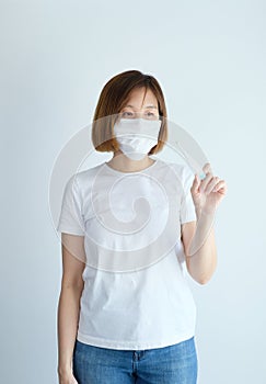 Woman wearing mask get sick from corona virus,, flu symptom as sneezing, cough, fever, body ache, breathing , pain