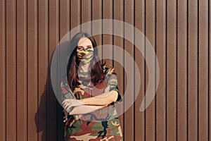 Woman Wearing Matching Camouflage Mask and Shirt