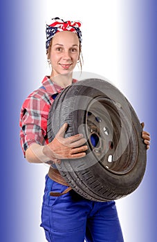 woman wearing a mechanic car wheel