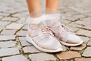 Woman wearing new comfy trainers and soft pink ruffle socks