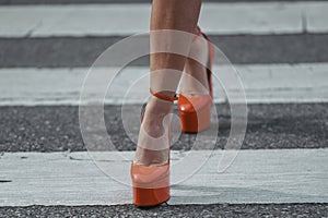 Woman wearing orange shoes