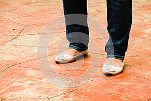 A woman wearing a pair of flat shoes at the park