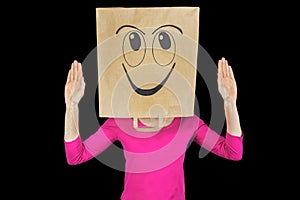 Woman wearing paper bag with face expressing happiness