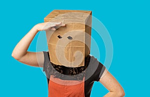 Woman wearing paper bag over her head