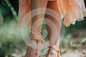 woman wearing peach anklet jewelry