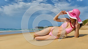Woman wearing pink bikini.