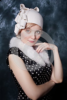 Woman wearing polka-dotted dress and felt adornment