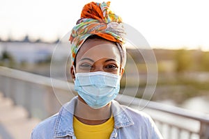 Woman wearing protective face mask outdoors