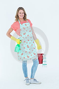 Woman wearing protective gloves and holding bucket