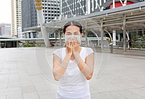 Woman wearing protective mask to protect pollution and the flu