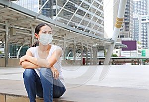 Woman wearing protective mask to protect pollution and the flu