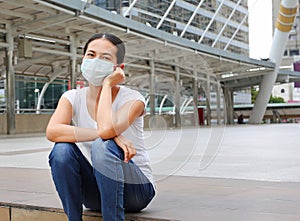 Woman wearing protective mask to protect pollution and the flu
