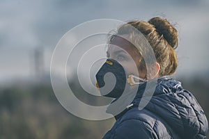 Woman wearing a real anti-pollution, anti-smog and viruses face mask