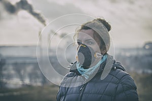 Woman wearing a real anti-pollution, anti-smog and viruses face mask