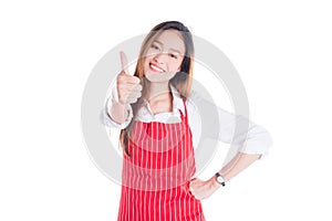 Woman wearing red apron ,smiling and showing thumb up