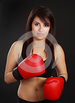 Woman wearing red boxing glove