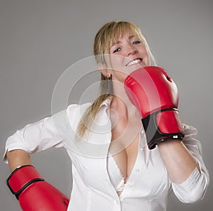 Woman wearing red boxing gloves