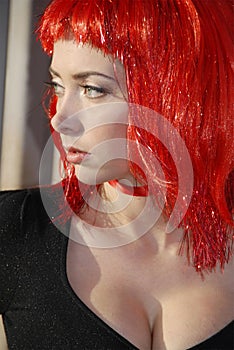 Woman wearing red glitter wig